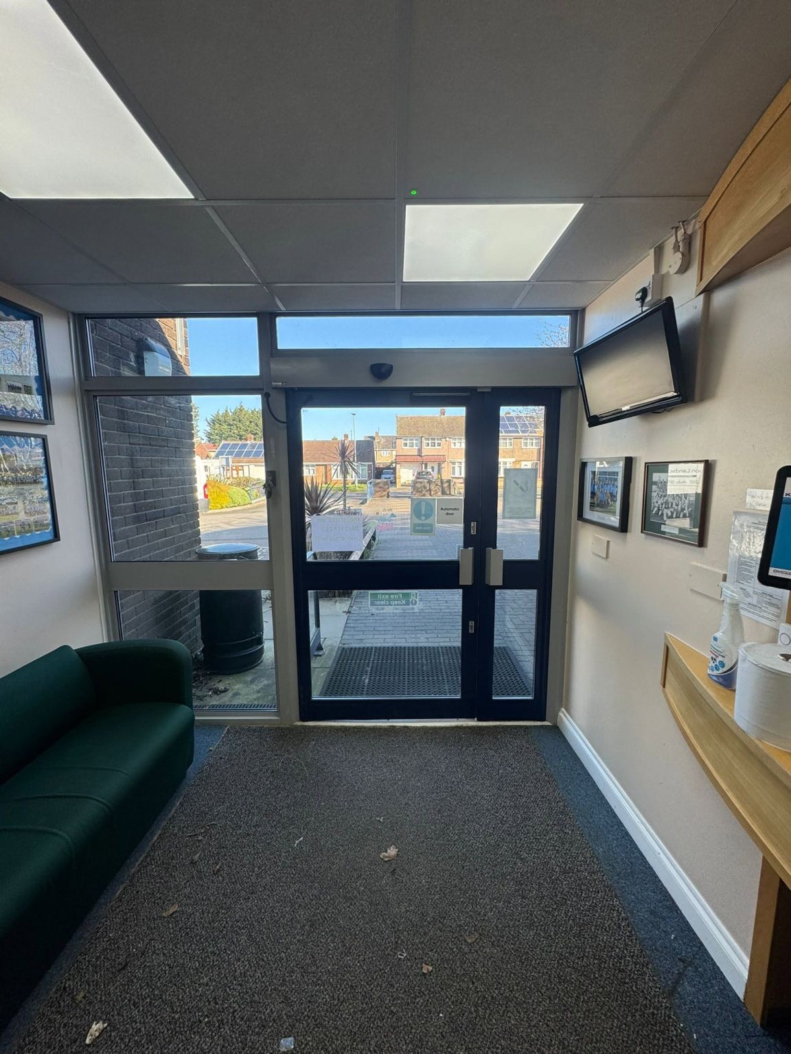 Original entrance with the concealed swing-door operator